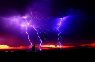 Purple sky lightning city nighttime - dramatic free wallpaper