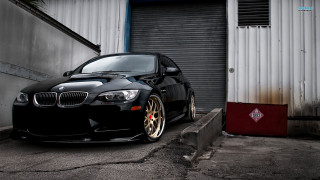 Black car garage red door - a black car free wallpaper