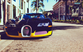 Bugatti parked road building sunny - the side of the road in front free wallpaper