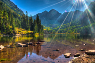 Mountain lake trees rocks sunlight - a mountain lake free wallpaper