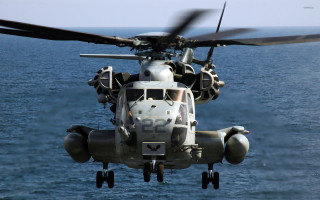 Helicopter flying ocean propellers wings - wing and a propeller free wallpaper