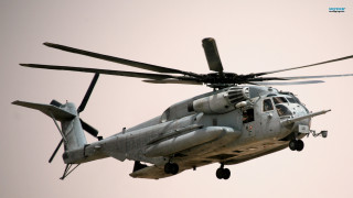 Helicopter flying sky person cockpit 2 - telephoto free wallpaper