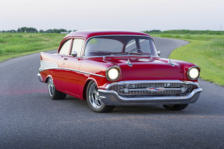 Red classic car driving road 2 - a red classic car free wallpaper