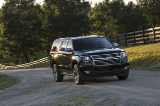 Black suv driving dirt road - a black suv free wallpaper