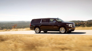 Black suv driving grass field - grass and trees free wallpaper