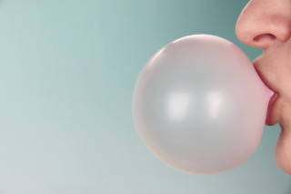 Woman blowing bubble white balloon - carol bove free wallpaper