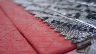 Cloth pattern red background stripe - a macro photograph free wallpaper