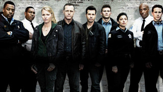 Group people brickwall arms crossed - a brick wall free wallpaper