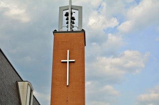 Tall brick tower cross clock - the top of it free wallpaper