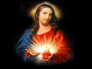 Jesus holding heart light shining - radiant free wallpaper