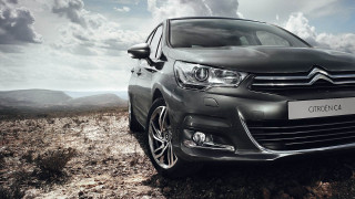 Black car desert rocky road - cloudy free wallpaper