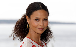 Woman curly hair hoop earrings - a lake in the background free wallpaper