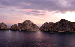 Rocks water beach sunset dawn - the water near a beach free wallpaper