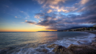 Beach water sunset clouds building - the shore free wallpaper
