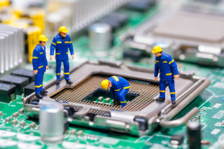 Close up computer motherboard workers - free technology wallpaper
