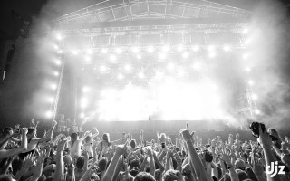 Concert crowd hands air stage - their hands in free wallpaper