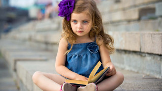 Little girl sitting book lap - a little girl free wallpaper