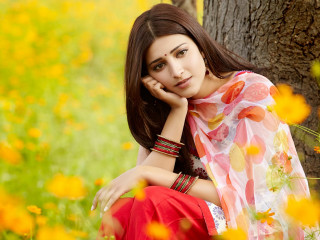 Woman sitting field flowers hand 2 - her cheek free wallpaper
