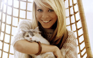 Woman holding cat smiling camera - a woman holding free wallpaper