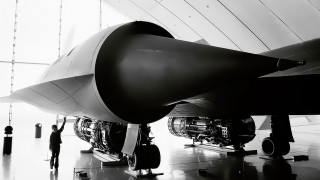 Man jet engine hangar looking - dahlov ipcar free wallpaper