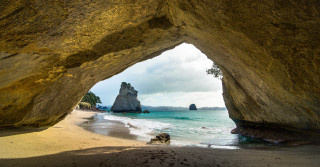 Beach rock formation water people - a few person free wallpaper
