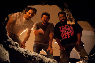 Three men cave smiling pointing - a cave free wallpaper