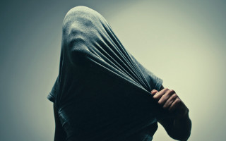 Hoodie serious person hands behind - their face free wallpaper