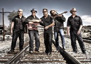 Men guitars train track sky - their hand and a sky background free wallpaper