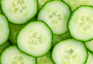 Cucumber closeup green leaves slices - half free wallpaper for desktop