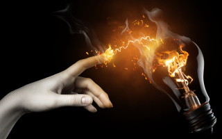 Hand lightbulb fire black background - a hand free wallpaper