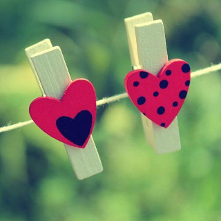 Two hearts hanging clothesline clothespins - free hearts wallpaper