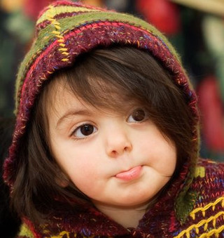 Little girl colorful knitted hoodie - a little girl free wallpaper