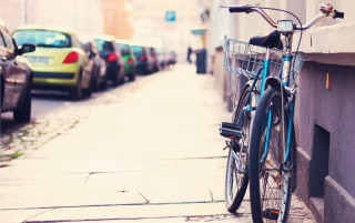 Bicycle parked street building cars - parked free wallpaper