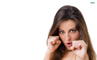 Woman hands face fist air - her right hand free wallpaper