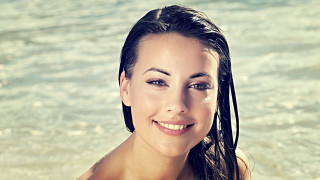Woman long hair standing water - head and shoulders portrait free wallpaper