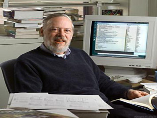 Man sitting desk computer books - michael kaluta free wallpaper