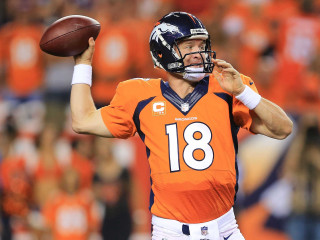 Man orange jersey throwing football - a football free wallpaper