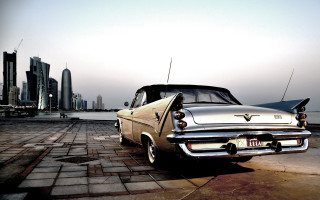 Car parked brick road city - a city skyline free wallpaper