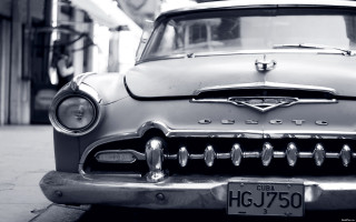 Classic car city street clock - a classic car free wallpaper