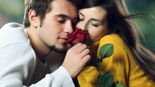 Man woman kissing holding rose 5 - a rose free wallpaper