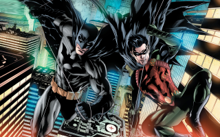 Batmans flying city arms outstretched - a cityscape in the background free wallpaper