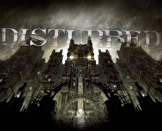Disturbed city clocktower gothic architecture - a clock tower in the middle of it free wallpaper