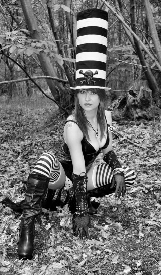 Woman striped hat boots kneeling - striped free wallpaper