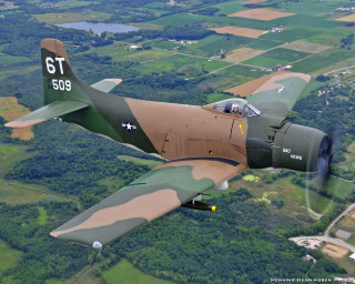 Military plane flying lush green - f 8 aperture free wallpaper