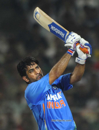 Man holding bat blue uniform 2 - an oil free wallpaper