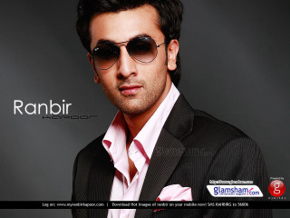 Man suit sunglasses posing picture - a man in a suit and sunglasses free wallpaper