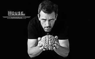 Man holding brain black background - carl hoppe free wallpaper