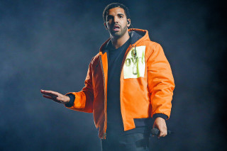 Man orange jacket hands out - the side of his face free wallpaper