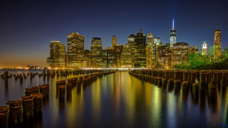 City skyline night water dock 4 - a dock in the foreground free wallpaper