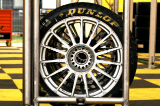 Tire metal stand checkered floor - a tire free wallpaper